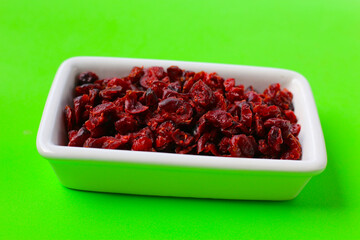 Dried cranberries piled on a white background