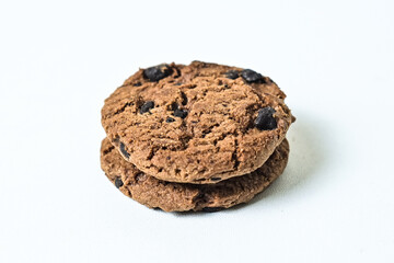 Close up view of two chocolate chip cookies isolated on white background. clipping path. pile, stack.