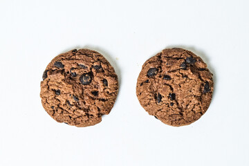 Top view of two chocolate chip cookies isolated on white background. Close up. clipping path. high angle, above.