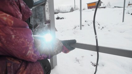 Metalworking in the challenging snowy conditions showcases immense skill and dedication amidst winters chill