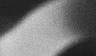 Grainy gradient subtly transitioning from light to dark, creating an abstract background with a...