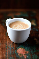 Cup of coffee on wooden background. Soft focus. Copy space	
