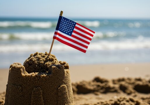 American Flag on a Sandcastle at the Beach a Concept for a 4th of July Summer Vacation