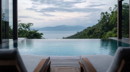 Fototapeta premium A tranquil infinity pool blends seamlessly with breathtaking views of mountains and nature, creating a perfect escape for relaxation and rejuvenation.