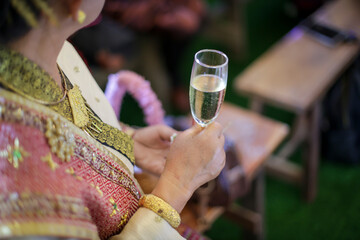 selective focus Champagne Glasses in hand with alcoholic beverages, welcome drinks for guests at a celebration, at a wedding