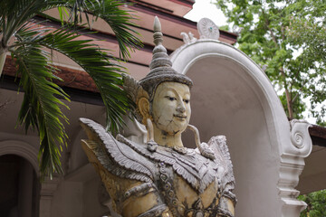 Old statues of Thai gods are located in front of the Thai temple in Chiang Mai.