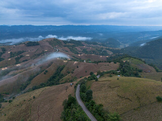 High angle view from a drone, agricultural area on the mountain that looks encroaching on the...