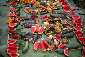 Watermelon slices and various fruits on banana leaves covered with banana leaves with various fruits. Elephant food at Thai Elephant Day, Elephant feeding fruit that it eats a lot of