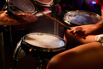 Close-Up of Drummer with Splashing Water