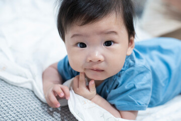 Asian adorable baby boy looking the camera