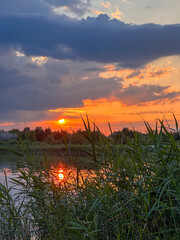 Serene Sunset Reflection Over a Tranquil Lake