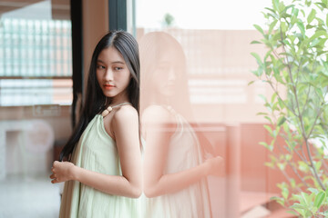 Teenage girl posing elegantly indoors contemporary home portrait photography calm atmosphere