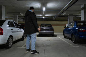 Person in Underground Parking Garage Figure Out of Stolen Car
