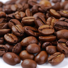 Roasted coffee beans close up background