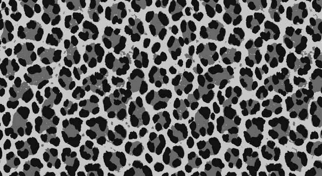 Seamless leopard print texture in shades of gray for backgrounds or textile design