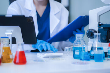 scientist researcher conducting an experiment working in the chemical laboratory.