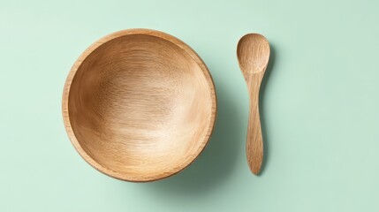Empty Wooden Bowl and Spoon on a Light Green Background Perfect for Food  or Mockups
