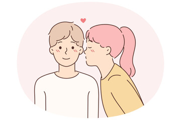 Little girl kisses lover on cheek for concept of first childhood love for boy friend