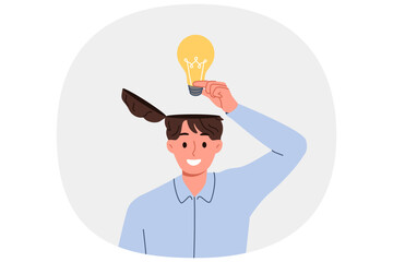Man learns about innovative idea puts light bulb inside head to improve own creative thinking. Brilliant idea from business guy came up with new invention during brainstorming session