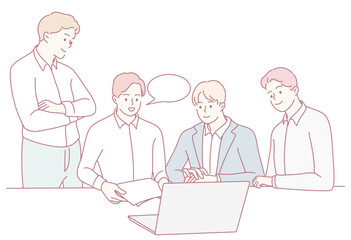 A group of professionals engaging in meaningful discussions about ideas and strategies while using a laptop