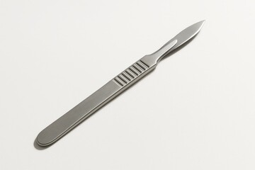 Stainless steel surgical scalpel on white background