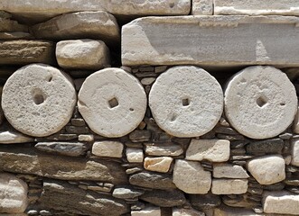 Photo of the ancient marble column drums reused in the Frankish castle, in Parikia on Paros island, a remarkable example of Cycladic architectural recycling from the classical period of Greece.