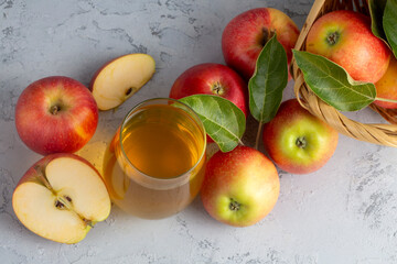 Apple juice in the glass with apples