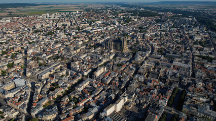 An Aerial panorama view with pan of the old town around the city Reims in France on a sunny spring...