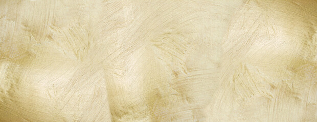 Shiny and rough gold metal texture. Scratched gold background.