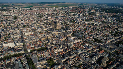 An Aerial panorama view with pan of the old town around the city Reims in France on a sunny spring...
