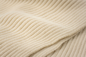 温もり感じる冬素材のベージュのニット生地アップ