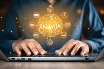 Person using a laptop with a glowing network of data icons and the words big data isolated on white background