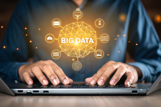 Person using a laptop with a glowing network of data icons and the words big data isolated on white background