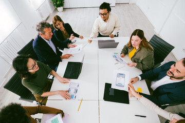 Ui/ux designers team working on mobile app design in modern office