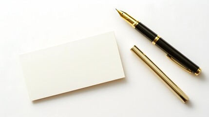 Photograph of blank stationery with a golden fountain pen and its cap on a white surface.