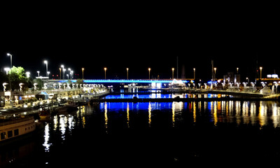 Fototapeta premium Town and sea port at night