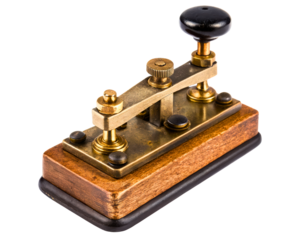 Vintage brass telegraph key on a wooden base on a transparent background