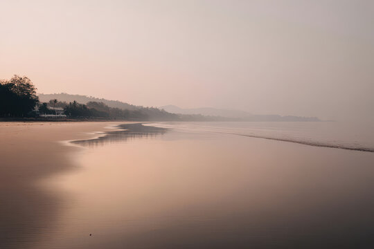 quiet seascape at dawn with gentle light faded colors of sky and water merging softly slight analog noise effect