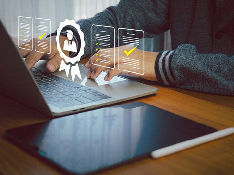Hands typing on laptop with digital icons of checklist and user badge, concept of online certification and quality assurance in business environment