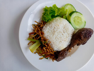 nasi rames well known in indonesia. this food usually be a common lunch in indonesian people. it...