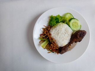 nasi rames well known in indonesia. this food usually be a common lunch in indonesian people. it contains a lot of protein, carbo, and vegetables make it more healthy.