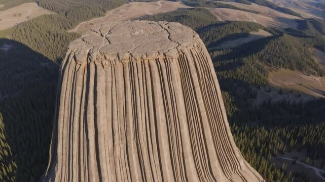 Stunning Drone Flyover of Wyomings Devils Tower Highlighting Vertical Rock FormationVideo Background