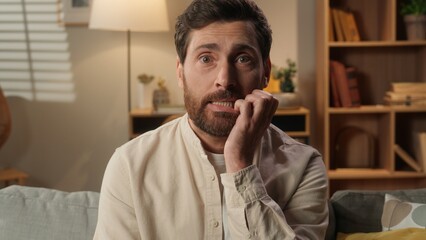 Caucasian man homeowner guy at home shrug shoulders unsure confused male stress uncertain homeowner...