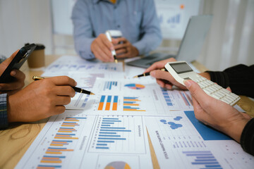 A professional business team collaborates around a conference table, analyzing charts, discussing strategies, reviewing reports, and planning innovative solutions to drive growth, efficiency, and long