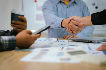 A professional business team collaborates around a conference table, analyzing charts, discussing strategies, reviewing reports, and planning innovative solutions to drive growth, efficiency, and long