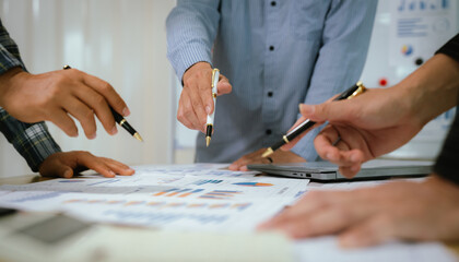 A professional business team collaborates around a conference table, analyzing charts, discussing strategies, reviewing reports, and planning innovative solutions to drive growth, efficiency, and long