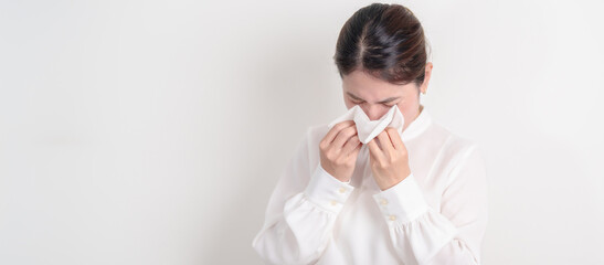 business woman blowing her nose with tissue for concepts of Common Cold, Influenza, Flu, Hay,...