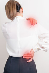 Business woman having back body ache for concepts of Back Muscle Strain, Piriformis Syndrome, Low...
