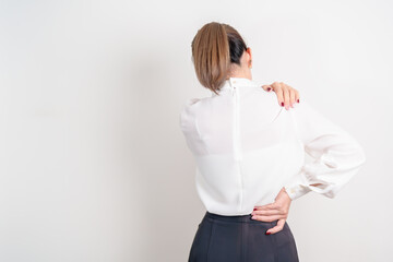 Business woman having back body ache for concepts of Back Muscle Strain, Piriformis Syndrome, Low...