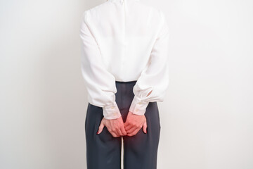 Business Woman having Anal symptoms pain for Hemorrhoids disease, Constipation, Anal cancer...
